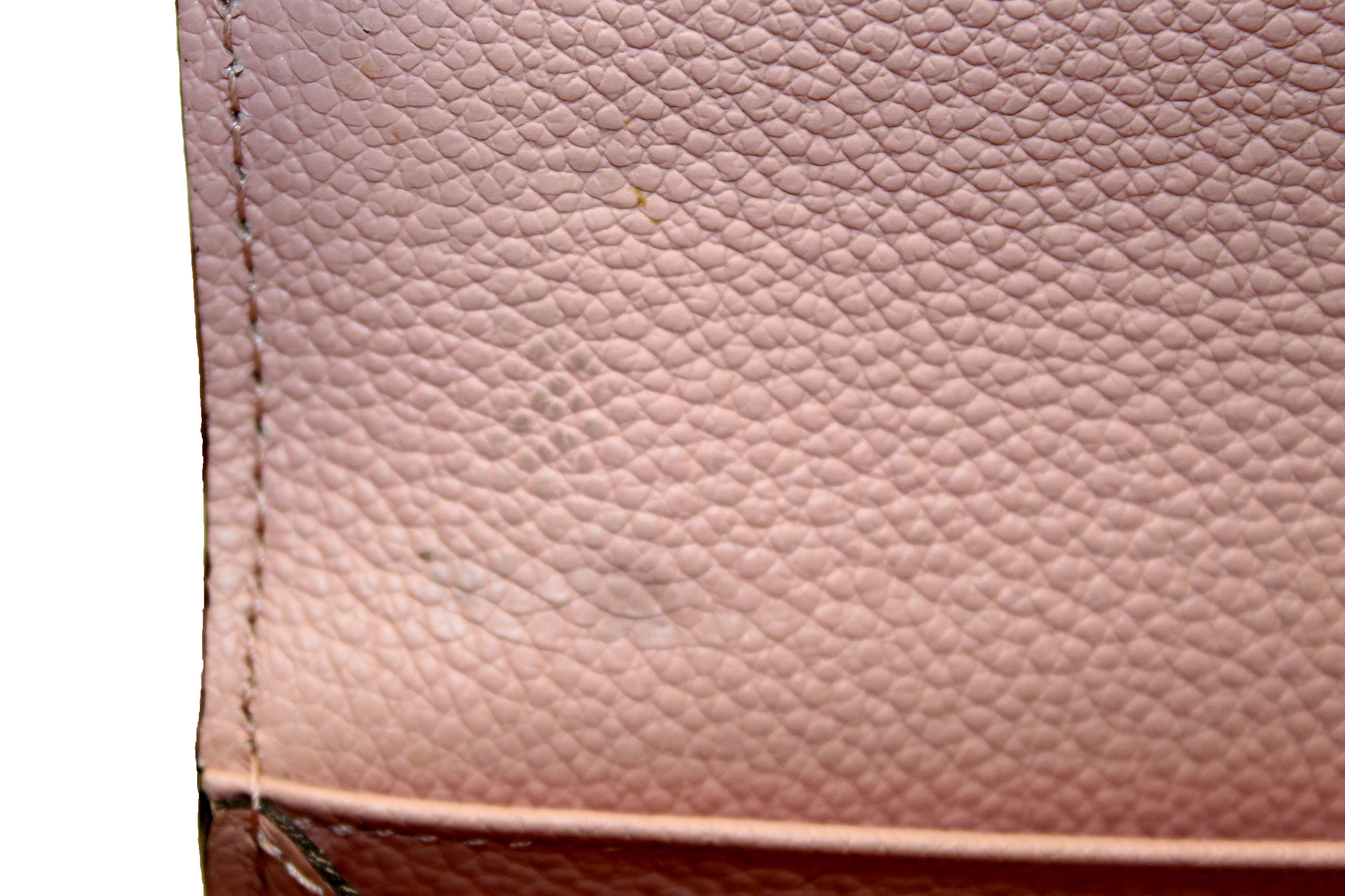 Authentic Louis Vuitton Pink Monogram Empreinte Leather Sarah Wallet