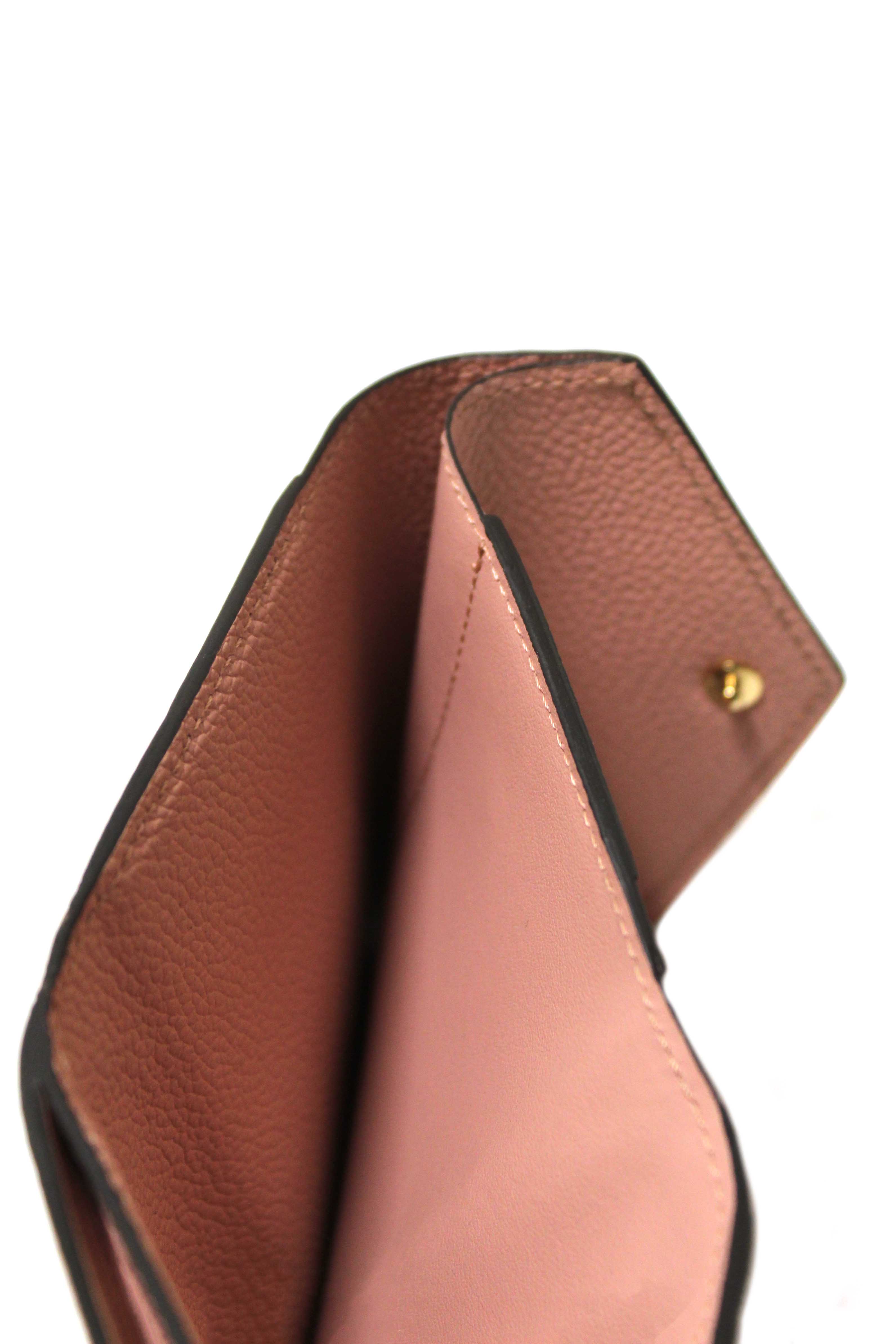 Authentic Louis Vuitton Pink Monogram Empreinte Leather Zoé Wallet