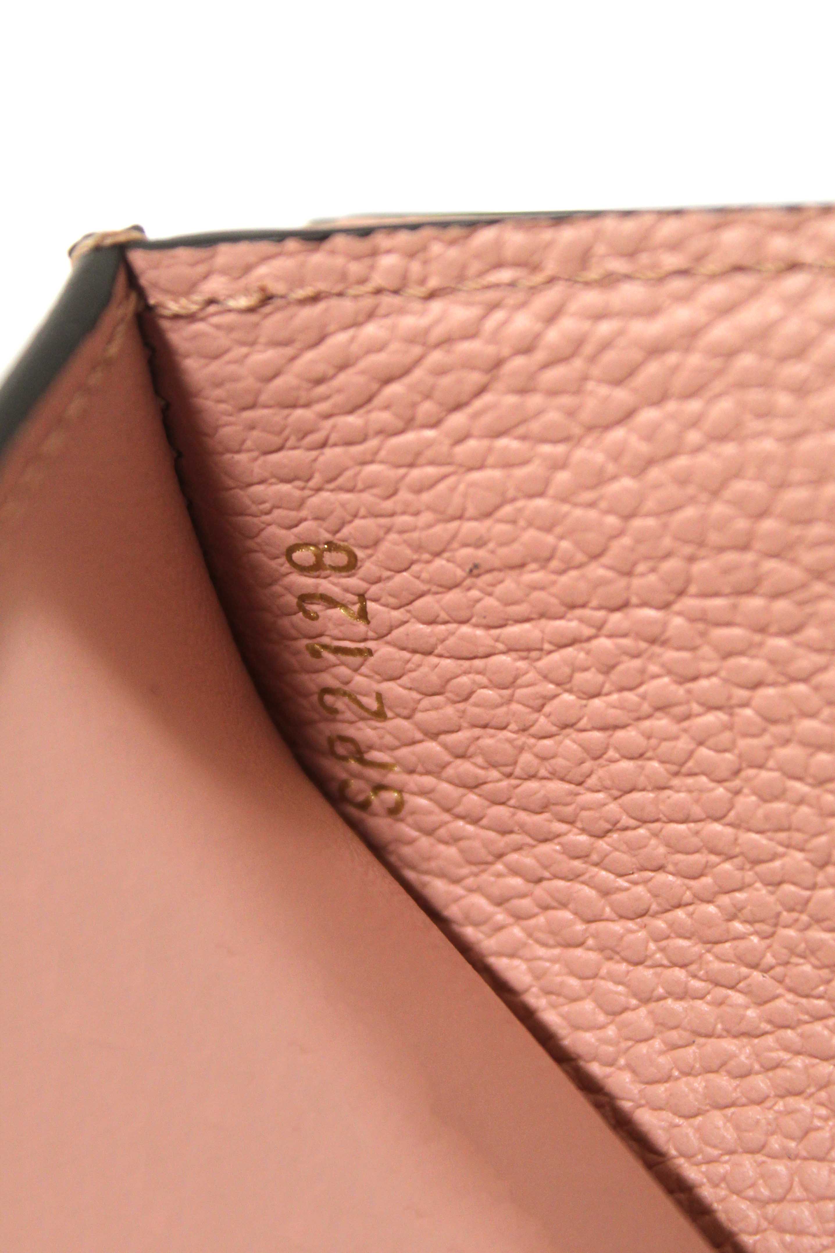 Authentic Louis Vuitton Pink Monogram Empreinte Leather Zoé Wallet
