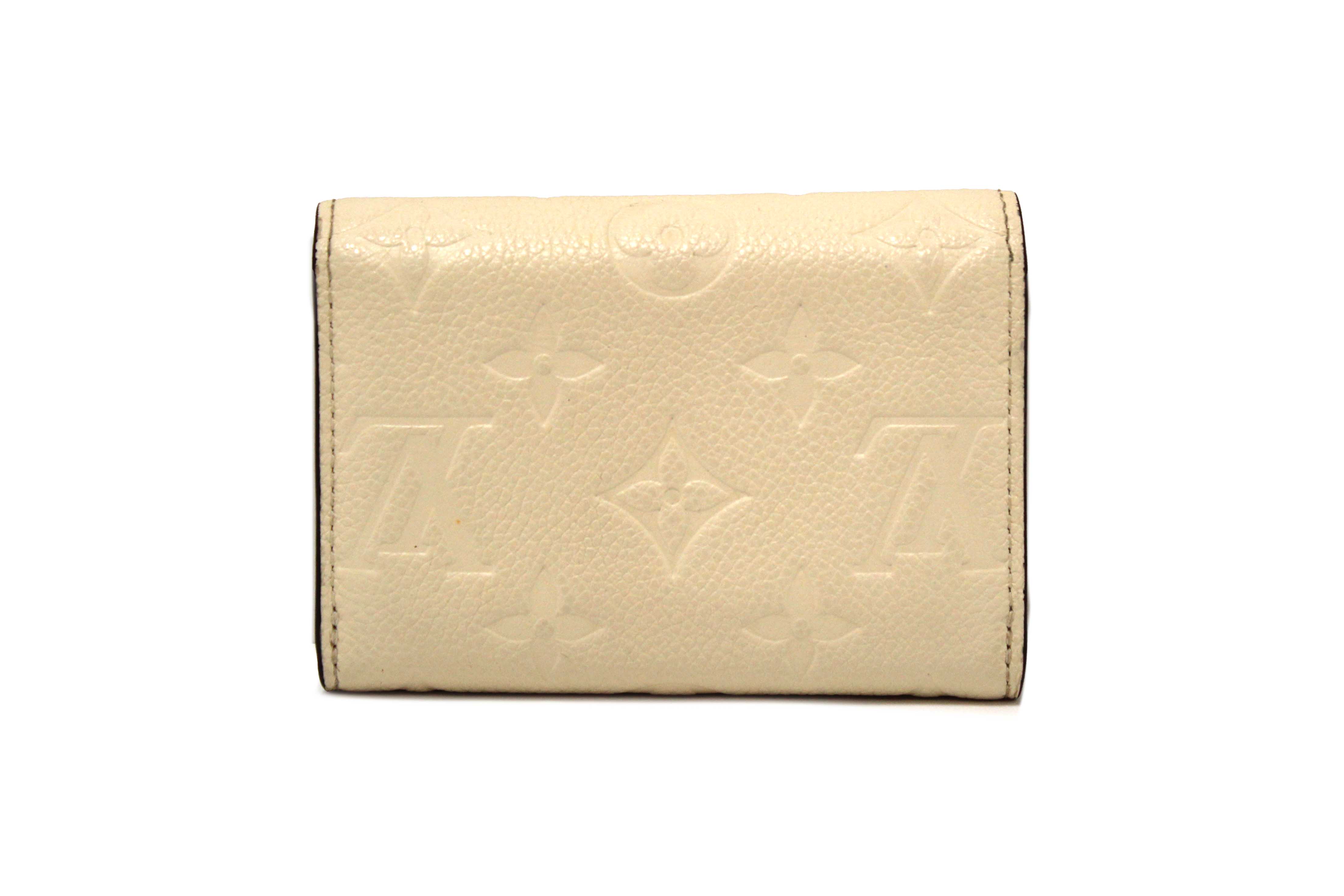Authentic Louis Vuitton Crème Monogram Empreinte Leather Rosalie Coin Purse