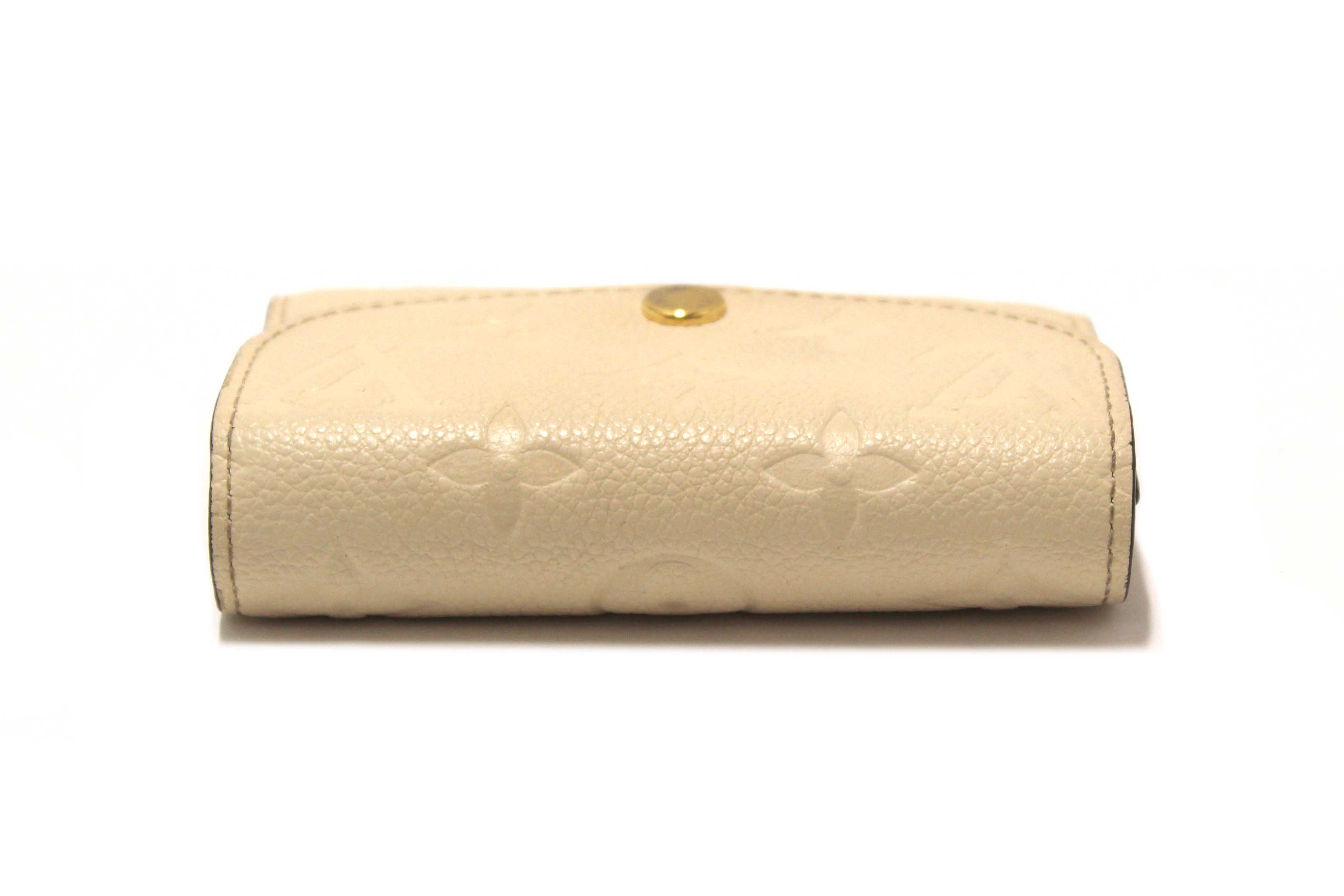 Authentic Louis Vuitton Crème Monogram Empreinte Leather Rosalie Coin Purse