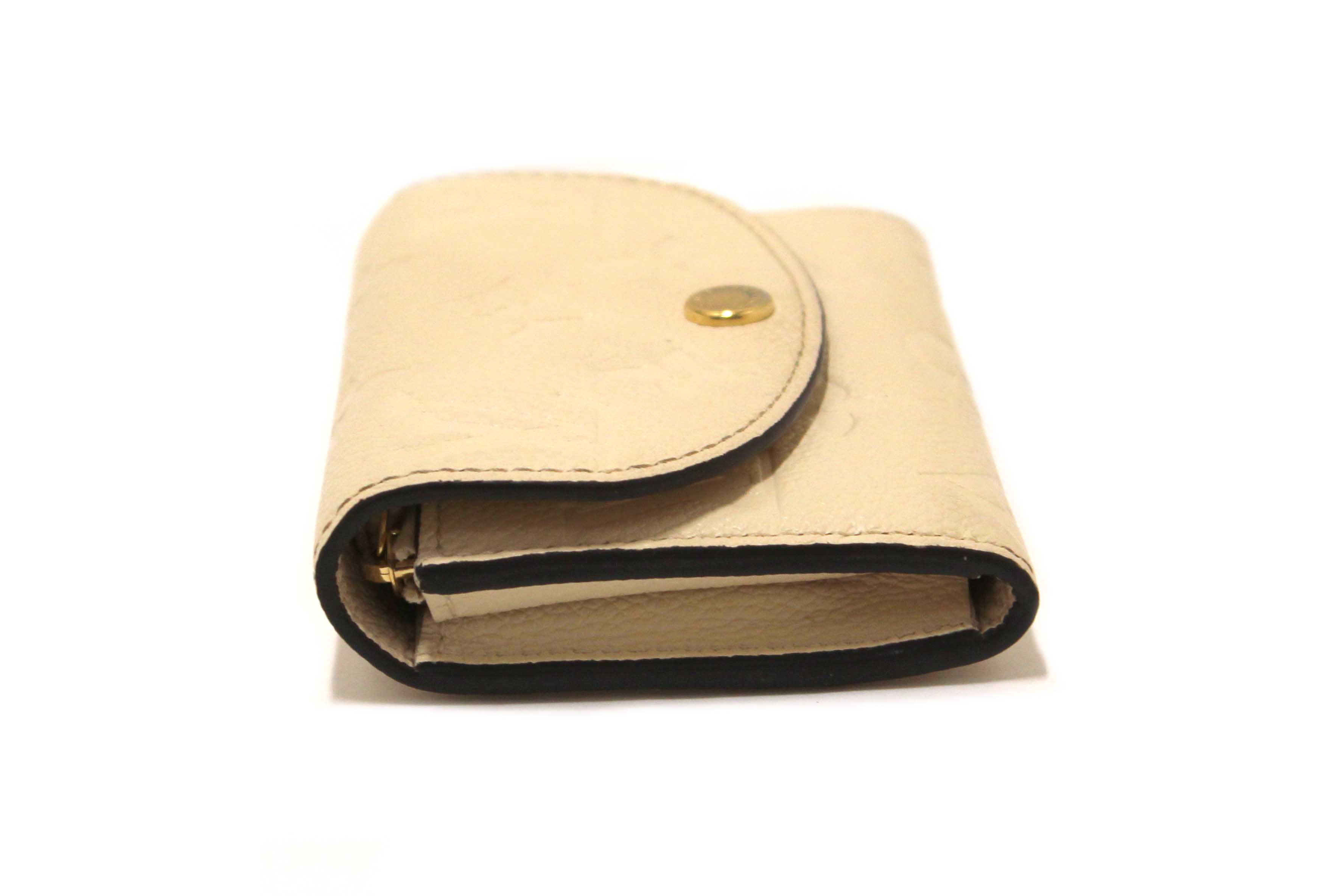 Authentic Louis Vuitton Crème Monogram Empreinte Leather Rosalie Coin Purse
