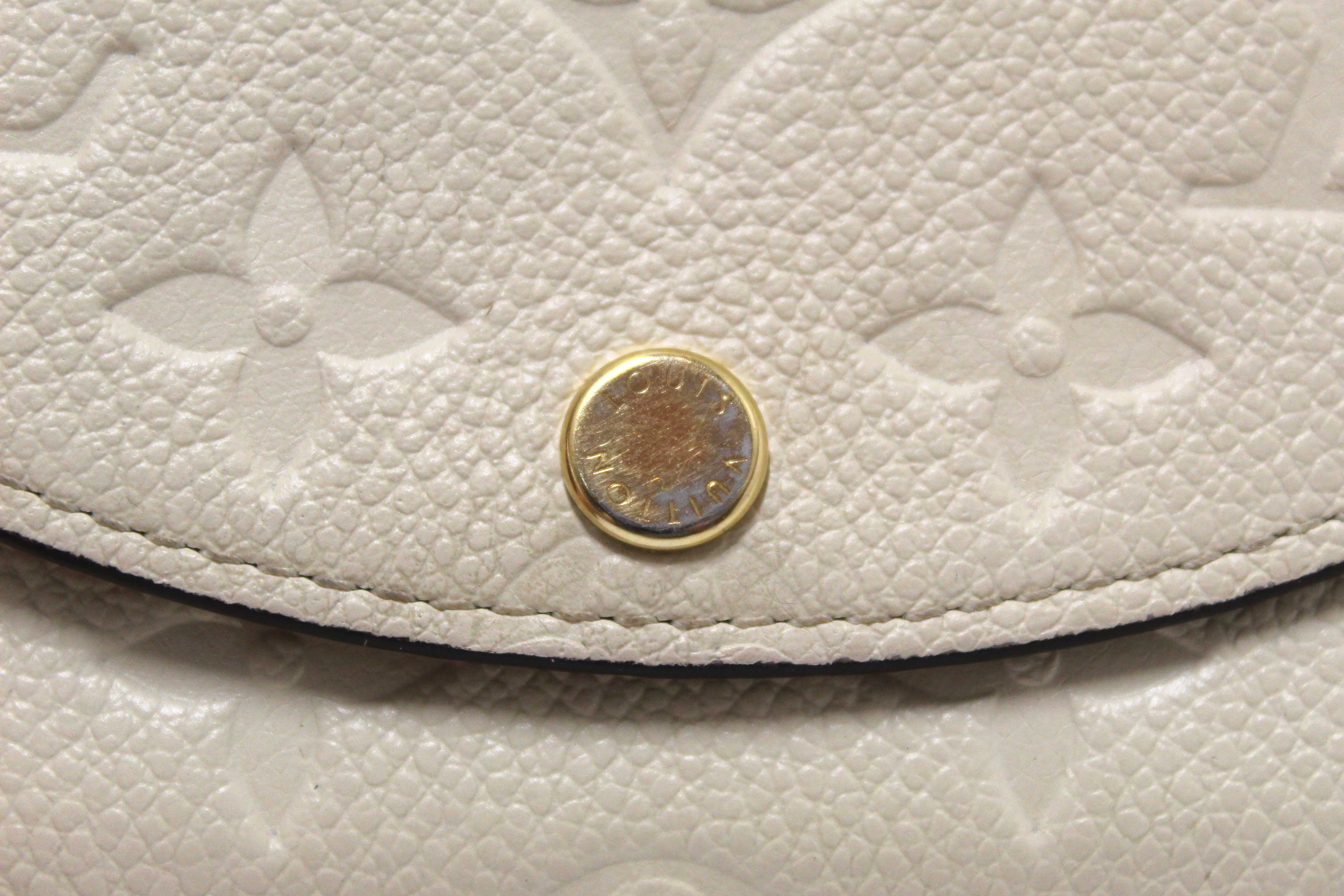 Authentic Louis Vuitton Crème Monogram Empreinte Leather Rosalie Coin Purse