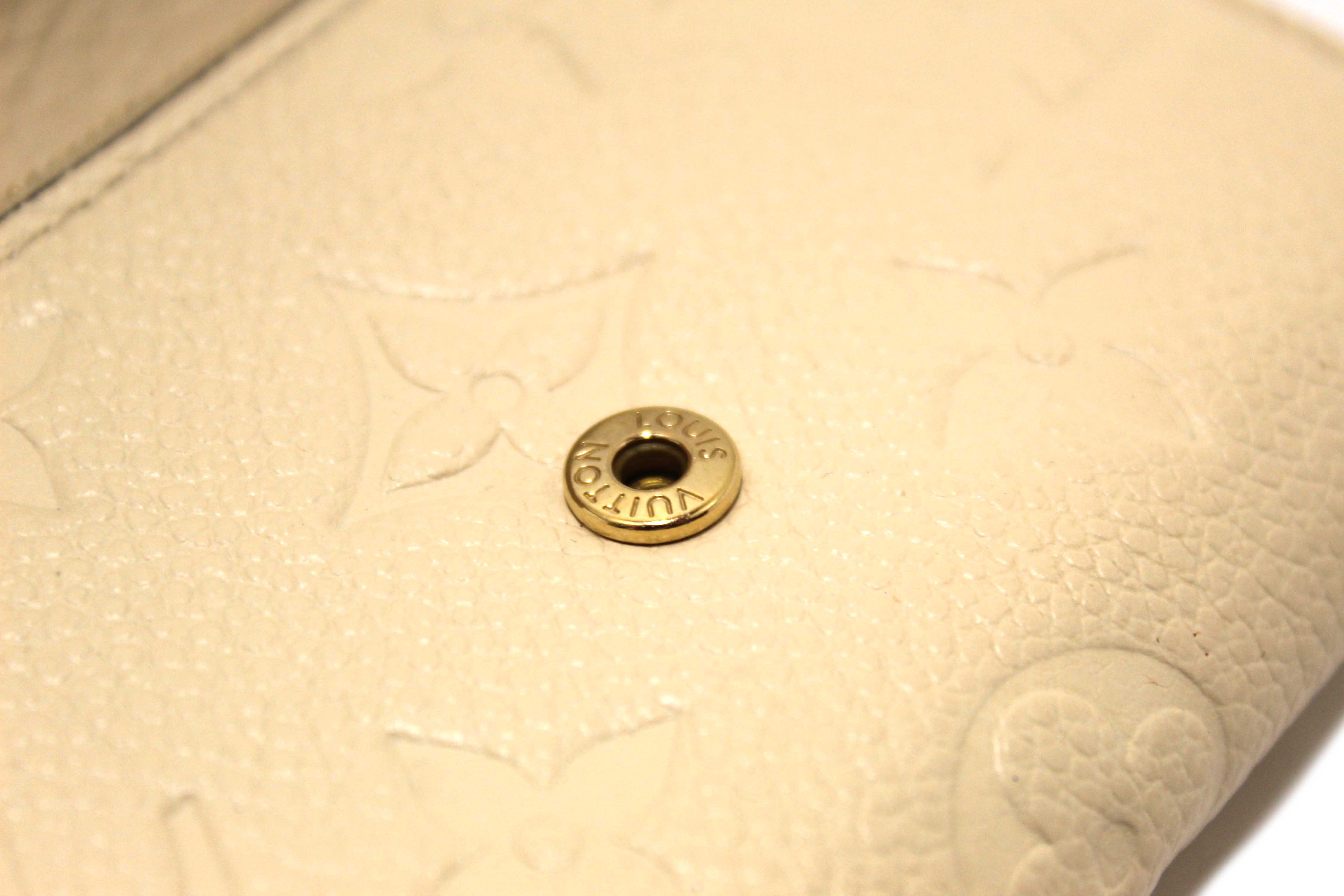Authentic Louis Vuitton Crème Monogram Empreinte Leather Rosalie Coin Purse