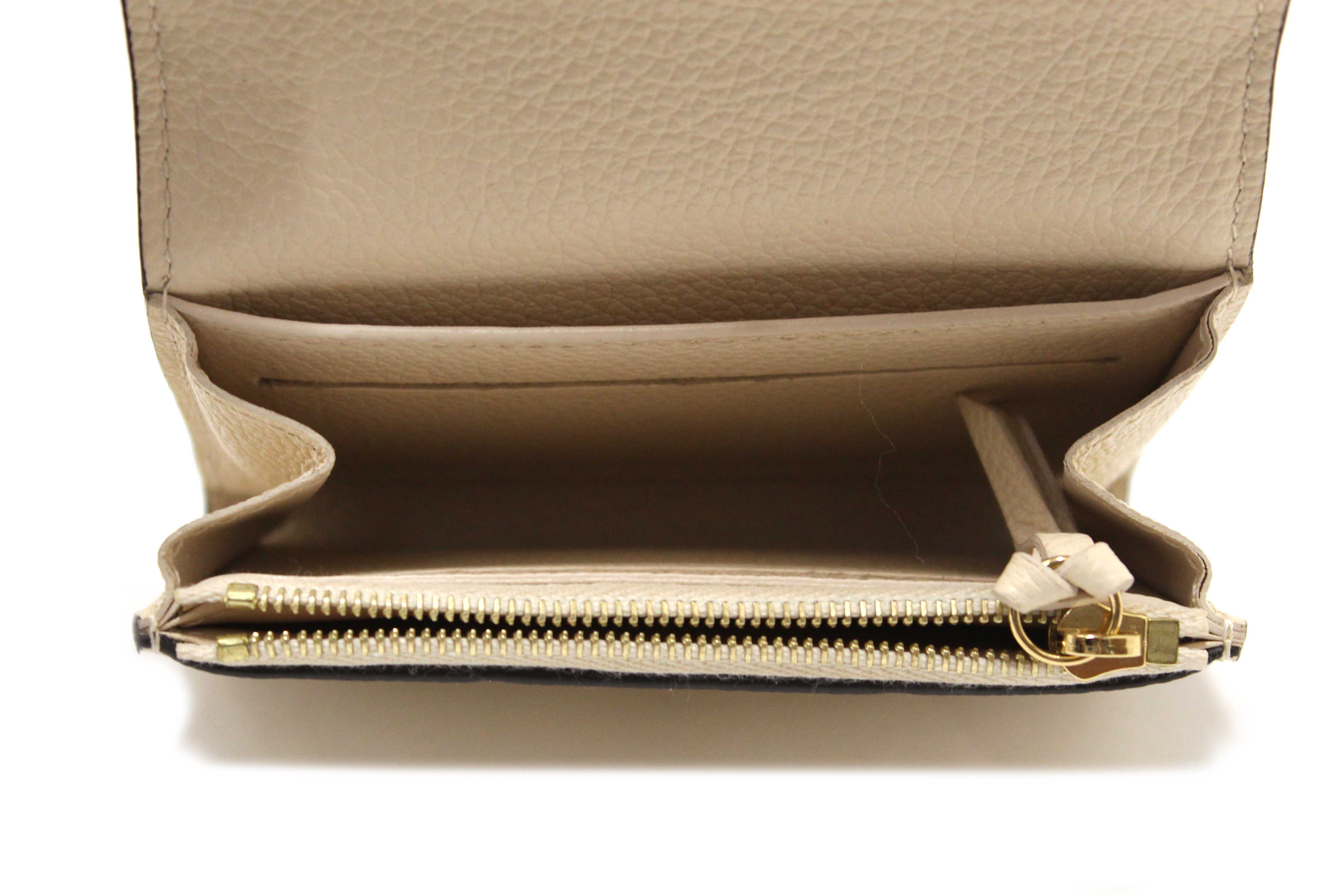 Authentic Louis Vuitton Crème Monogram Empreinte Leather Rosalie Coin Purse