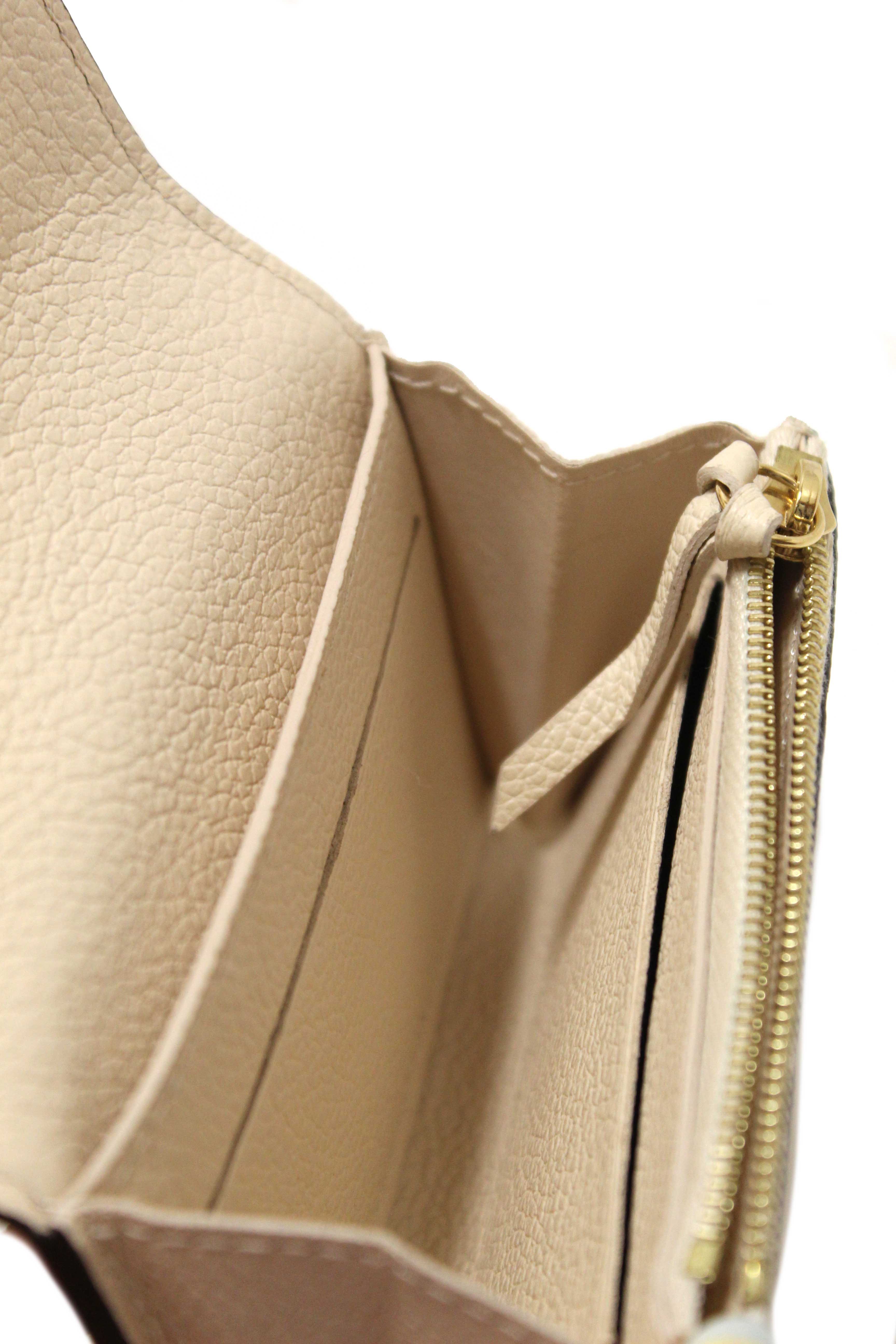 Authentic Louis Vuitton Crème Monogram Empreinte Leather Rosalie Coin Purse