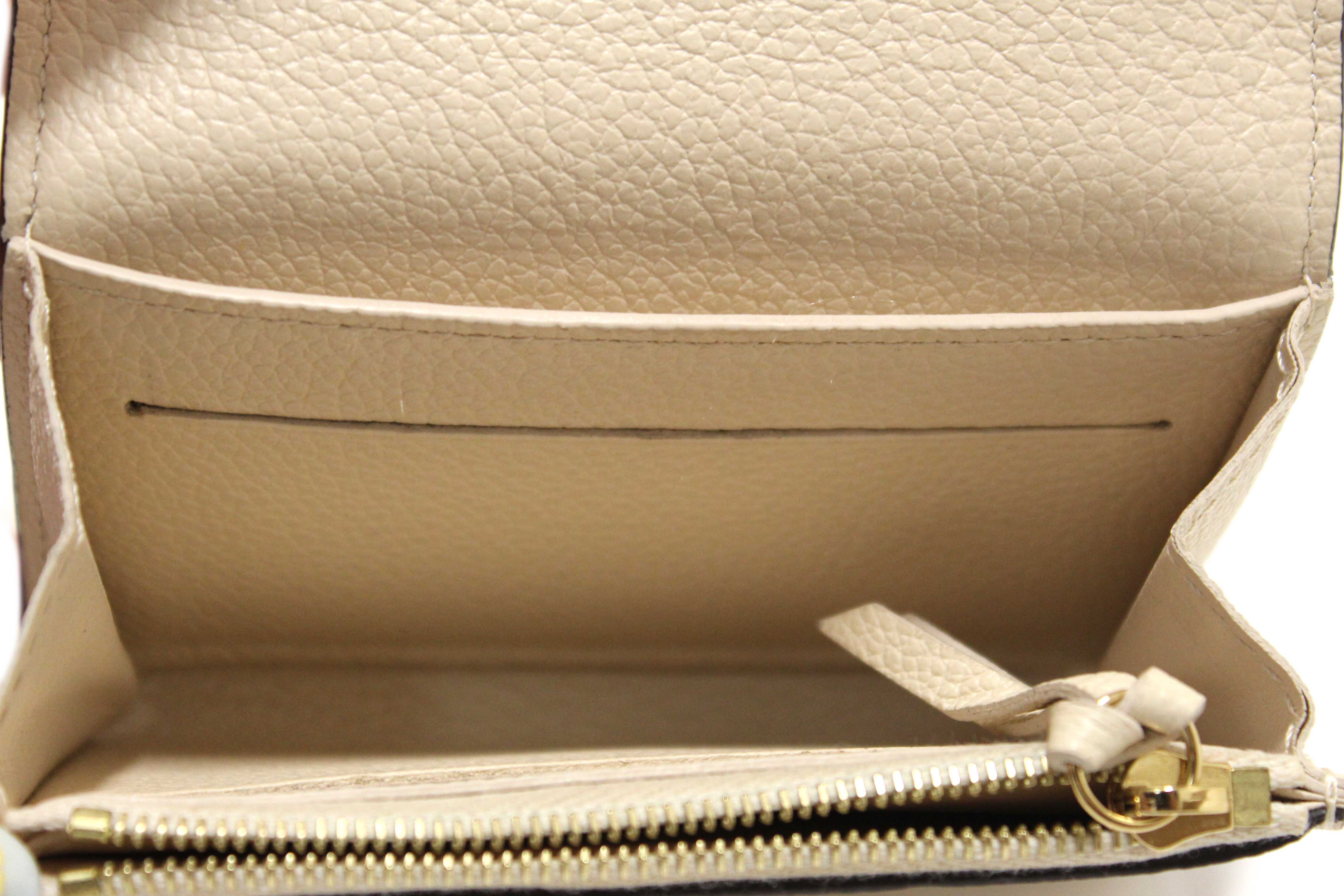 Authentic Louis Vuitton Crème Monogram Empreinte Leather Rosalie Coin Purse