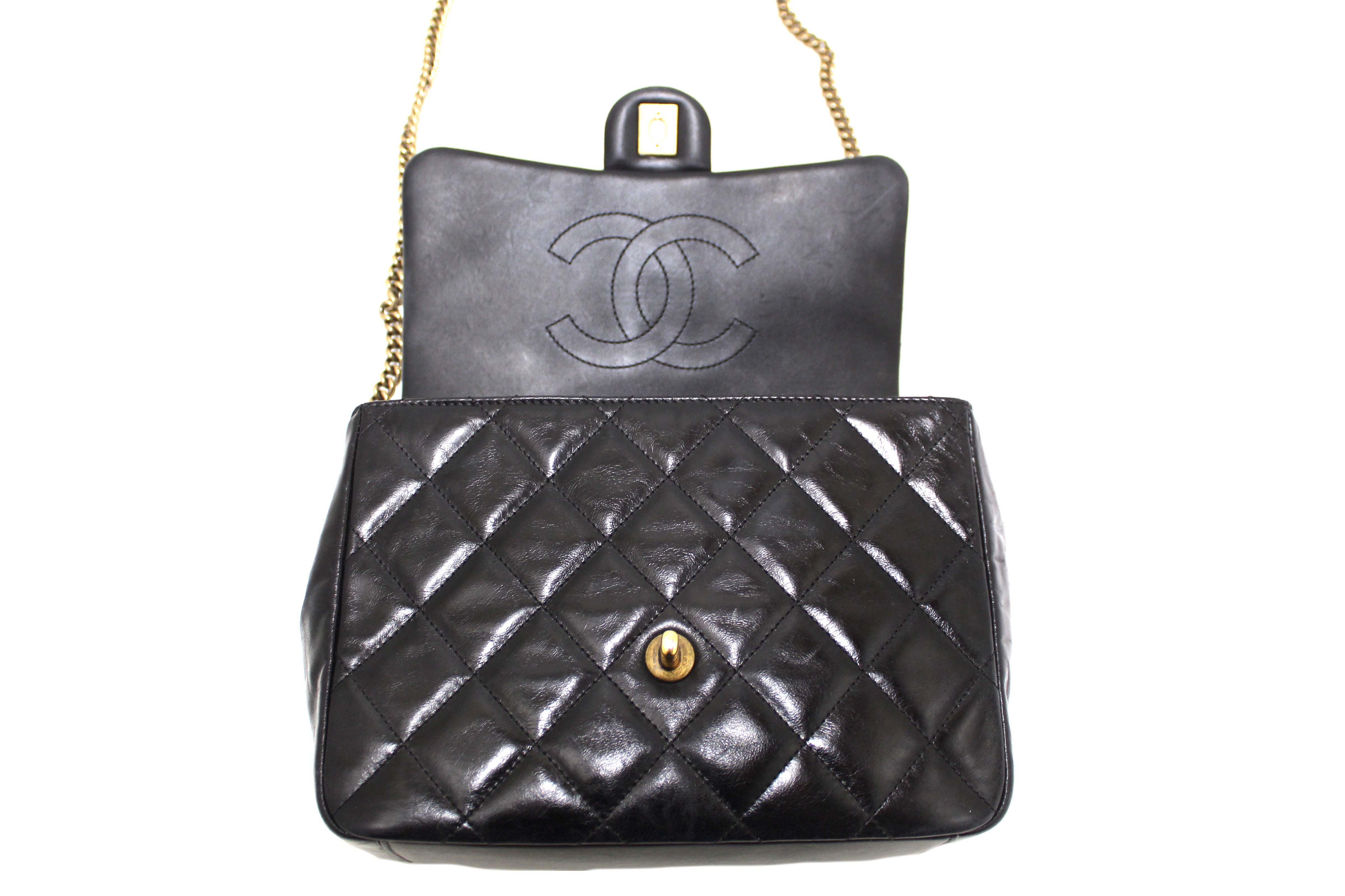 Authentic Chanel Black Aged Quilted Calfskin Leather Gold Bar Top Handle Medium Flap Bag