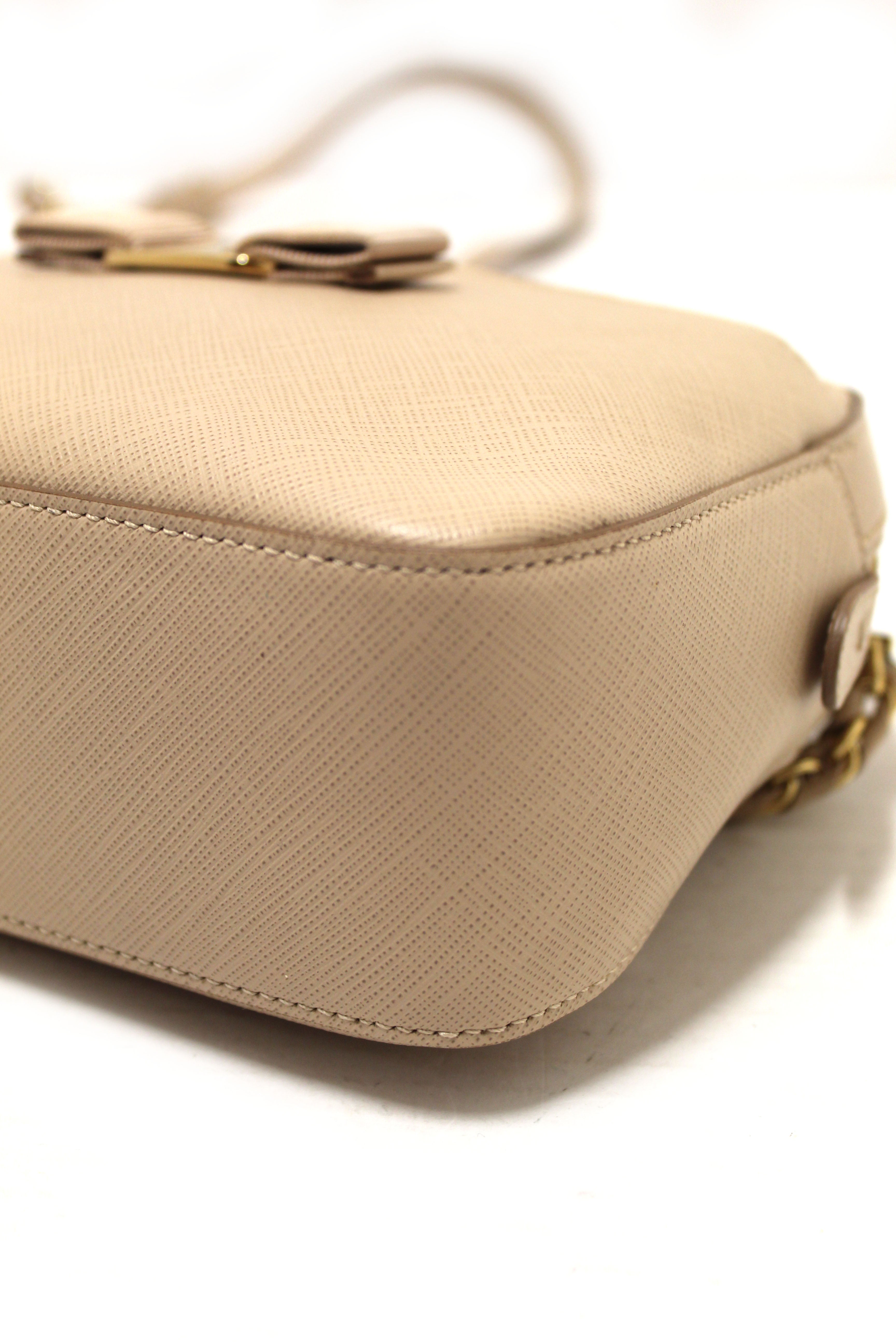 Authentic Salvatore Ferragamo Beige Calfskin Leather Lydia Bow Camera Crossbody Bag