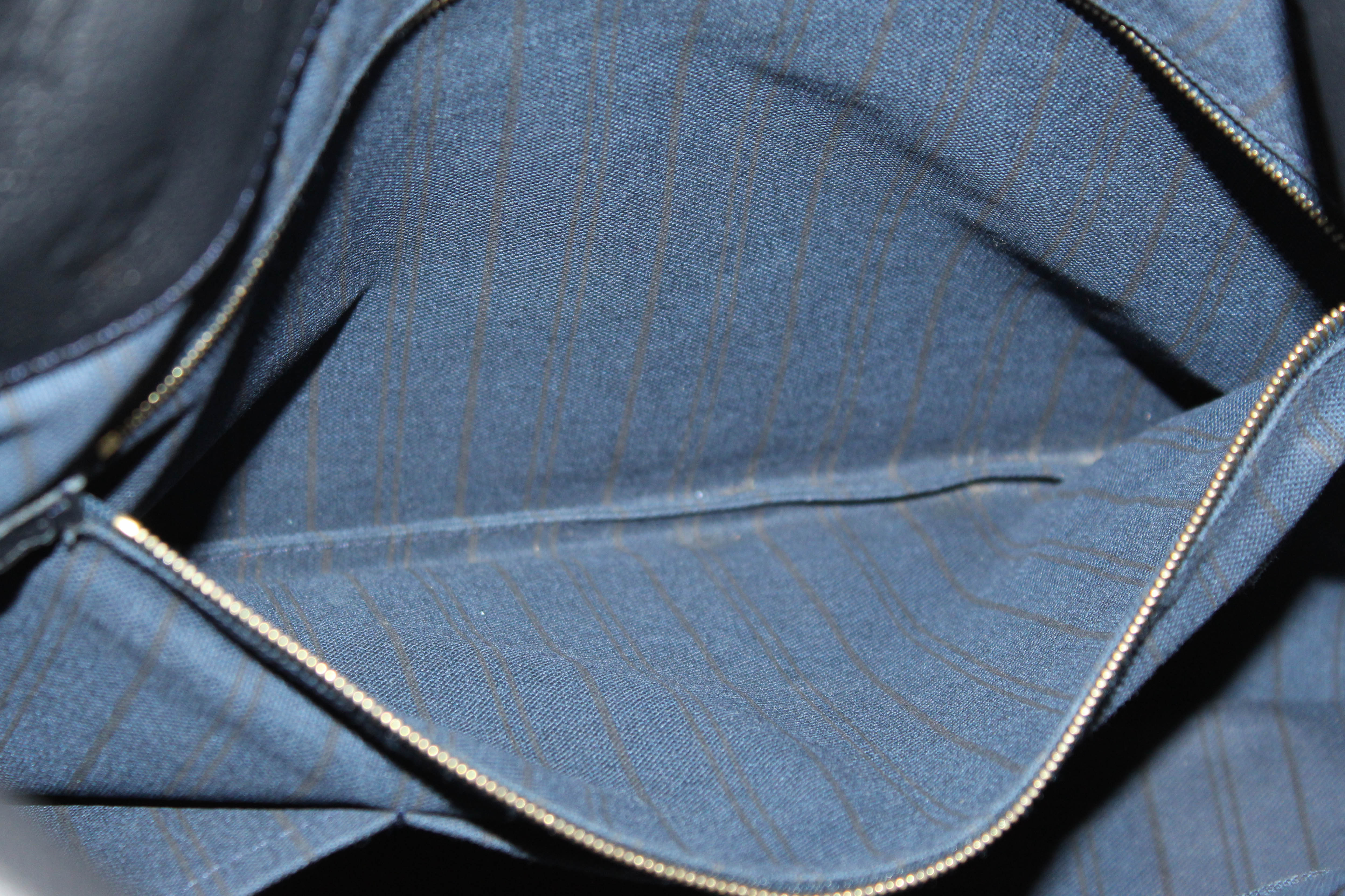 Authentic Louis Vuitton Blue Empreinte Leather Artsy MM Hobo Bag
