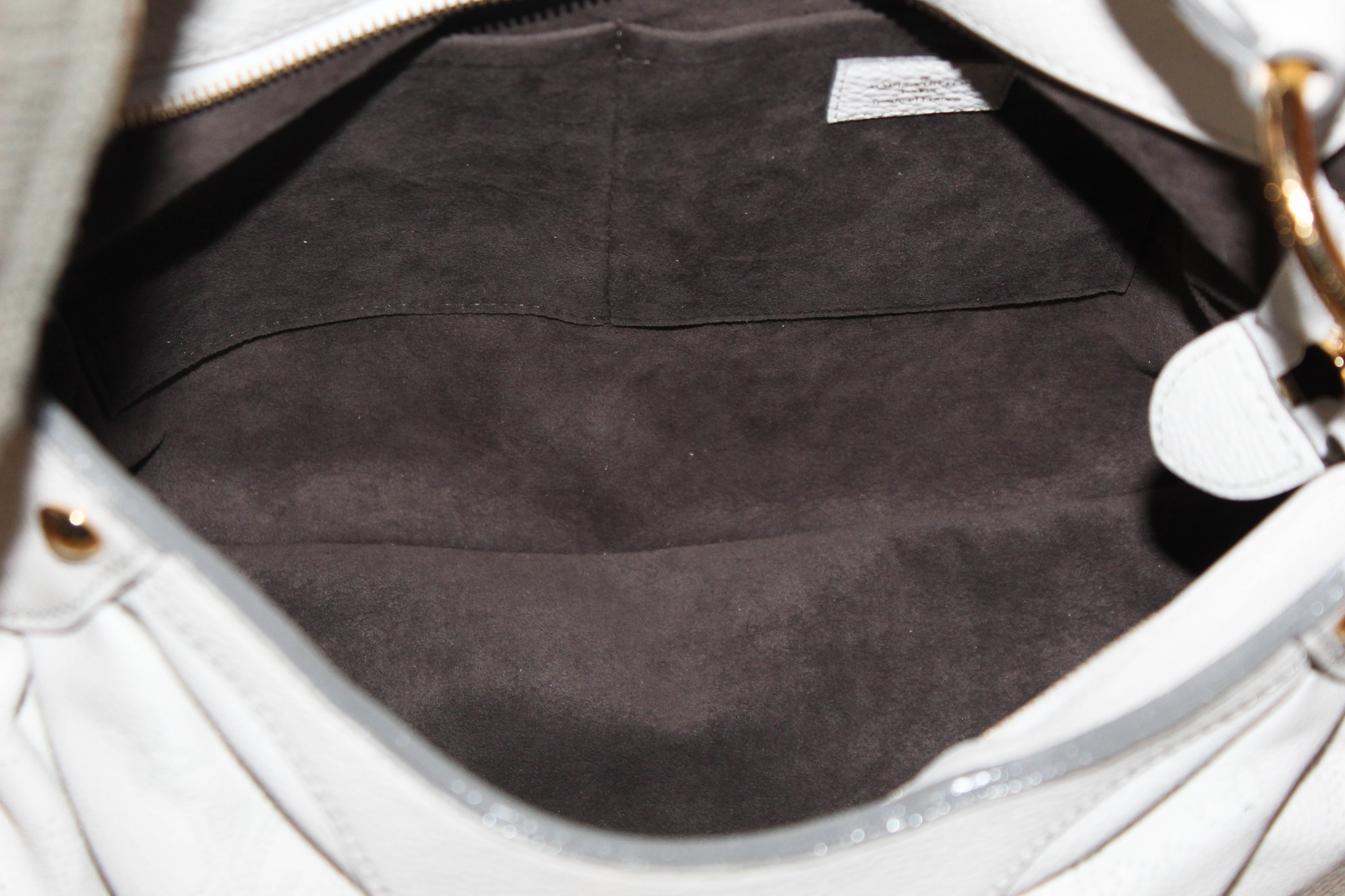 Authentic Louis Vuitton White Perforated Monogram Mahina Leather Solar PM Shoulder Bag