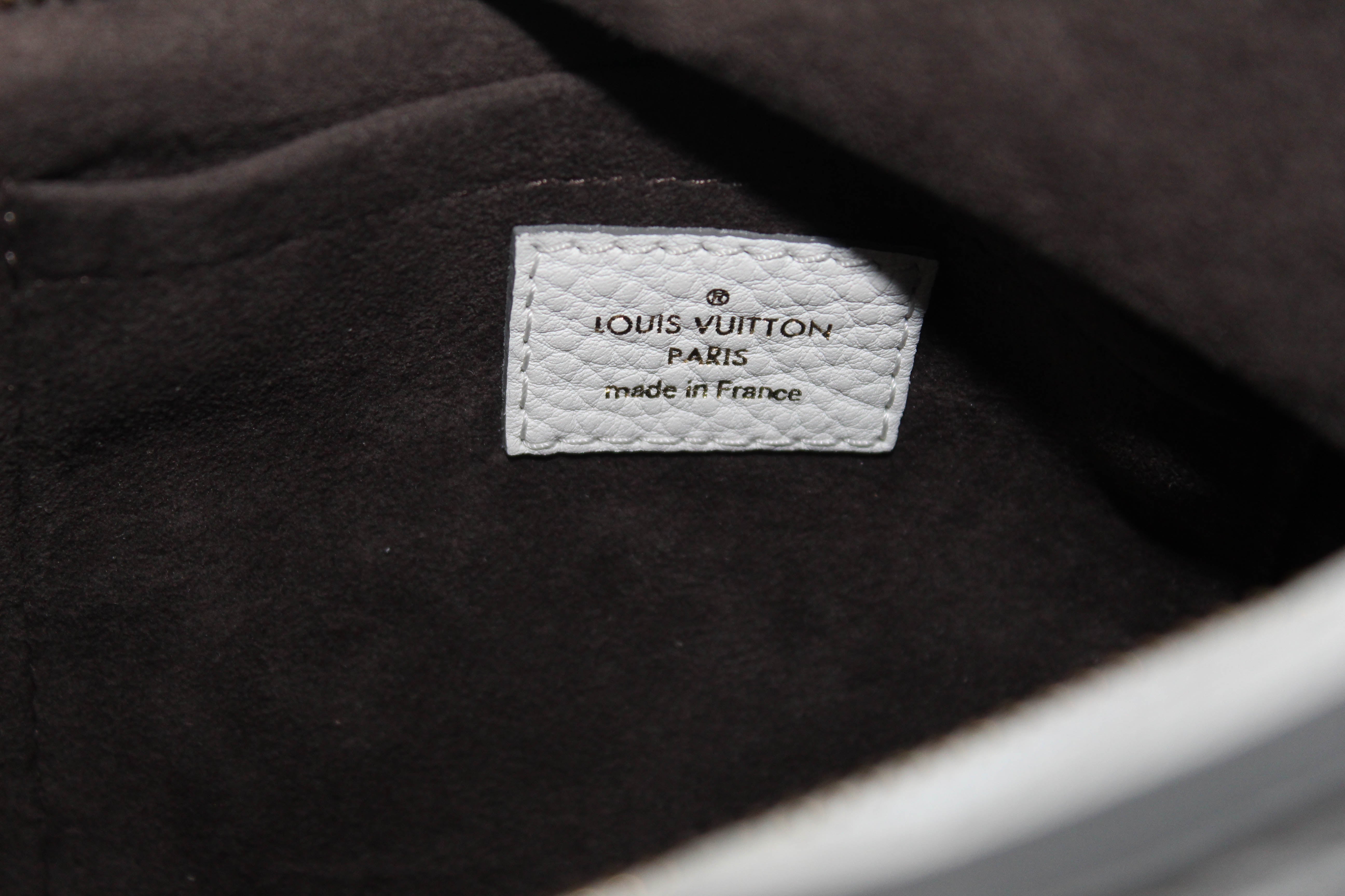 Authentic Louis Vuitton White Perforated Monogram Mahina Leather Solar PM Shoulder Bag