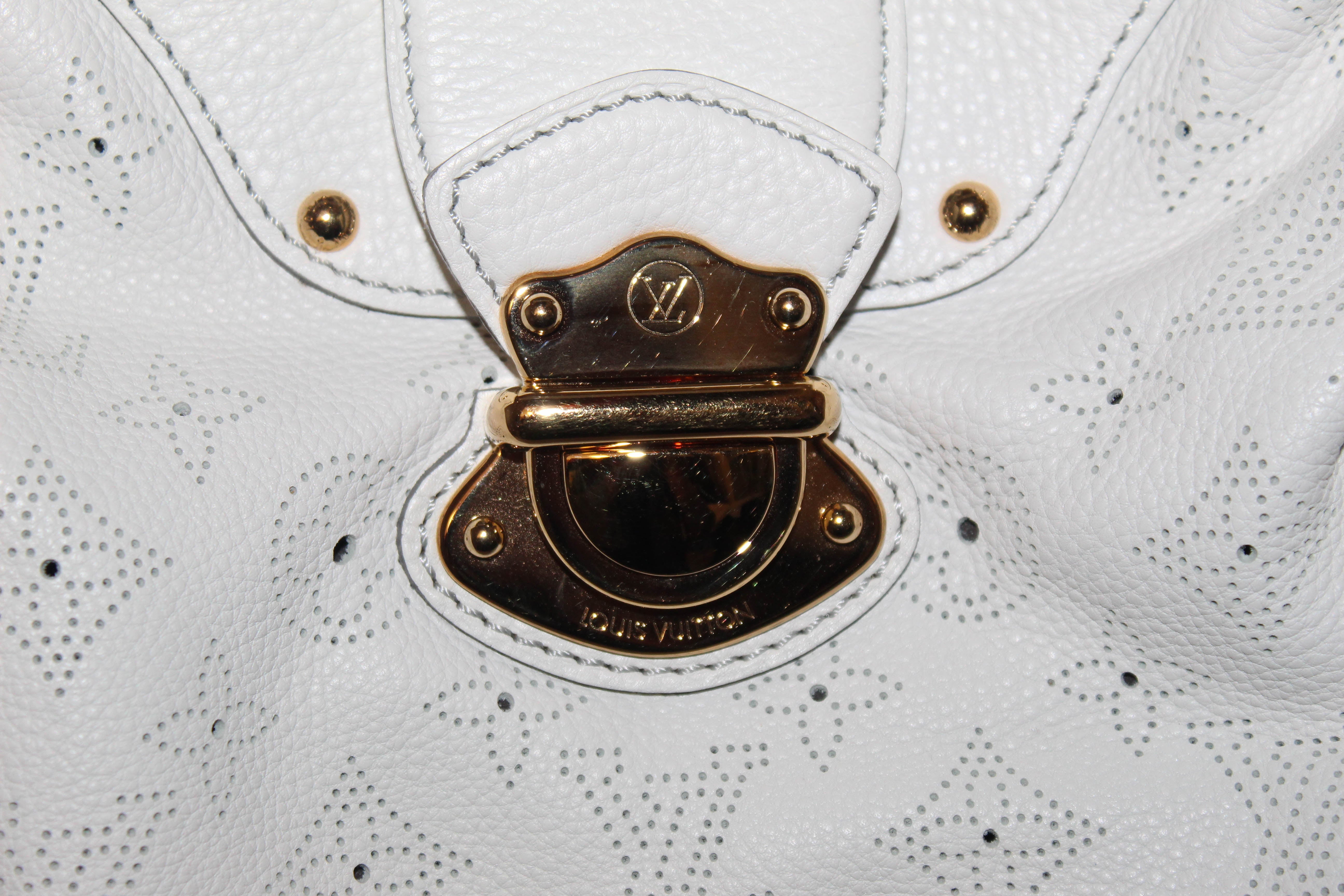 Authentic Louis Vuitton White Perforated Monogram Mahina Leather