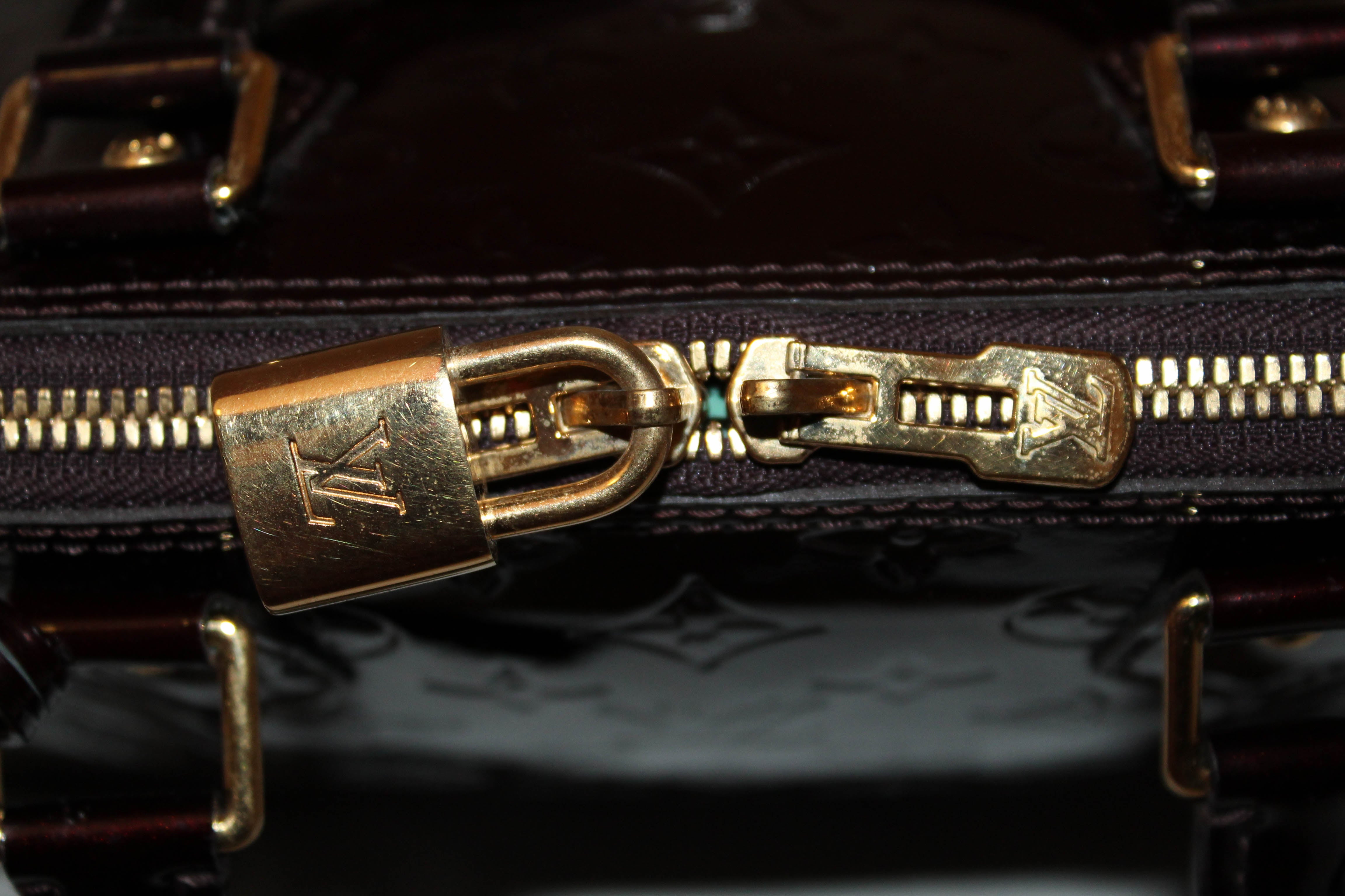 Authentic Louis Vuitton Amarante Monogram Vernis Leather Alma PM Handbag