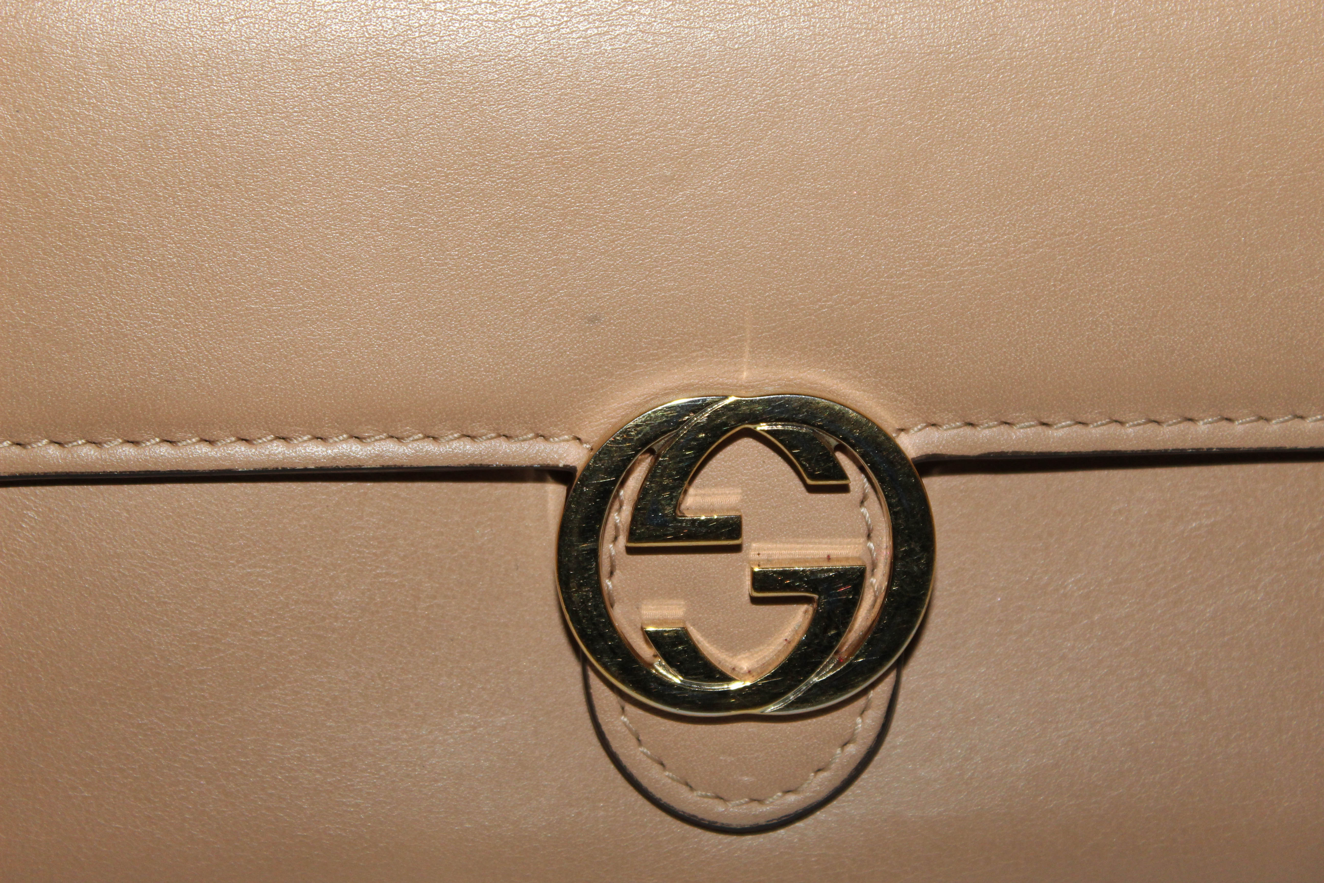 Authentic Gucci Beige Interlocking GG Soft Calfskin Leather Flap Wallet