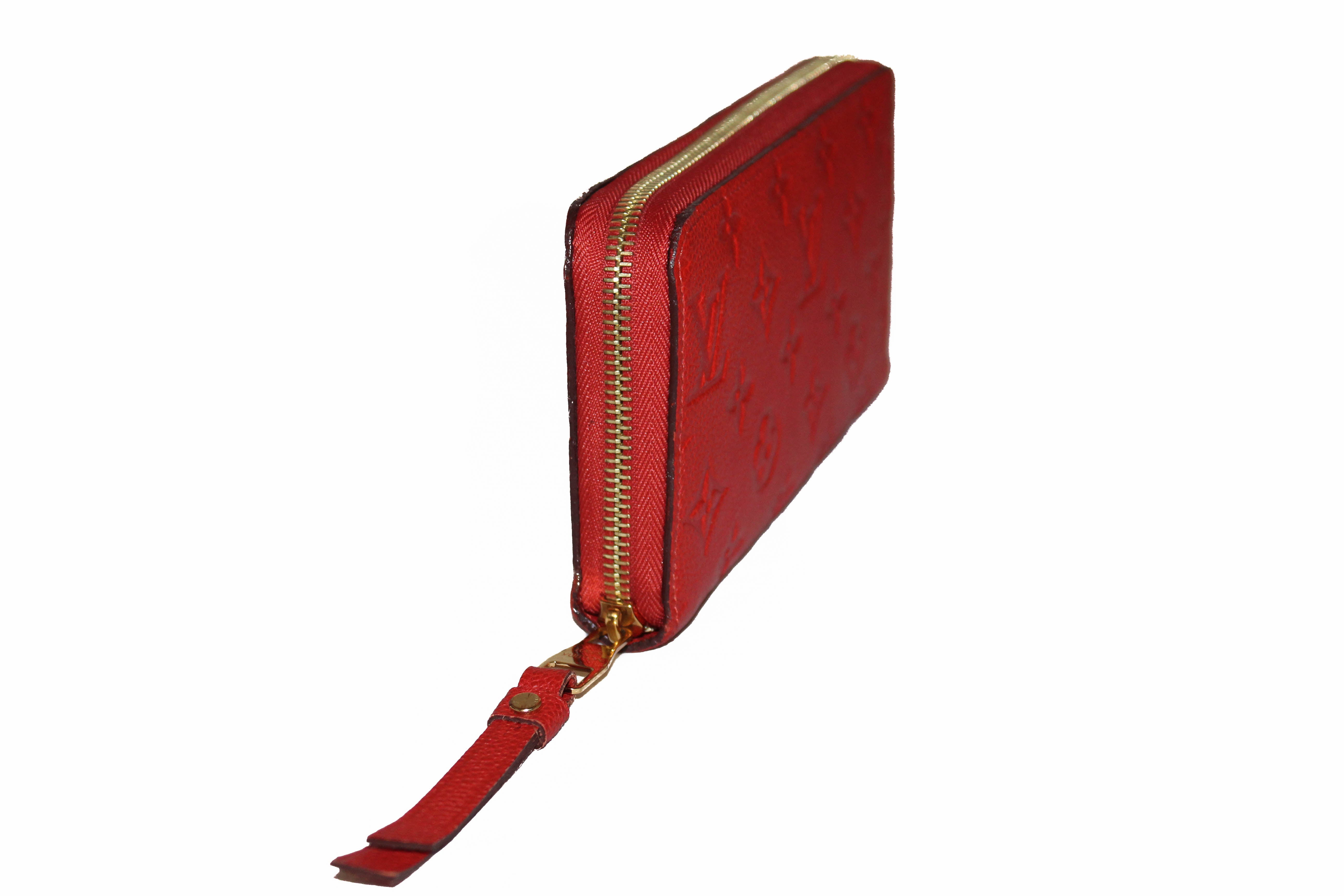Authentic Louis Vuitton Orange Red Orient Monogram Empreinte Leather Zippy Wallet