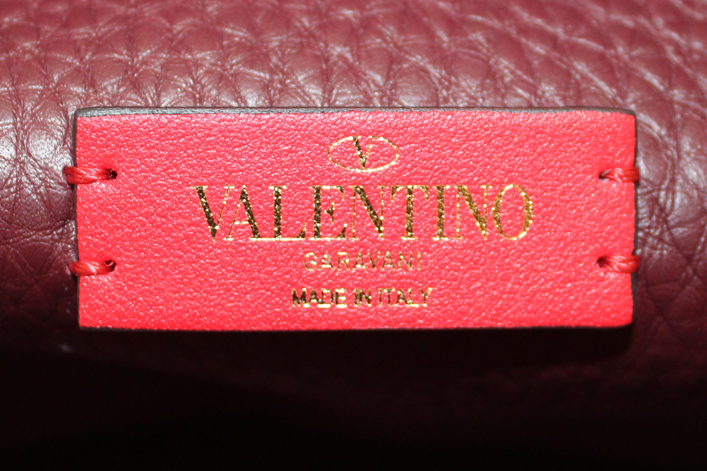 Authentic NEW Valentino Garavani Burgundy Pebbled Calfskin Rockstud Haftmoon Saddle Bag