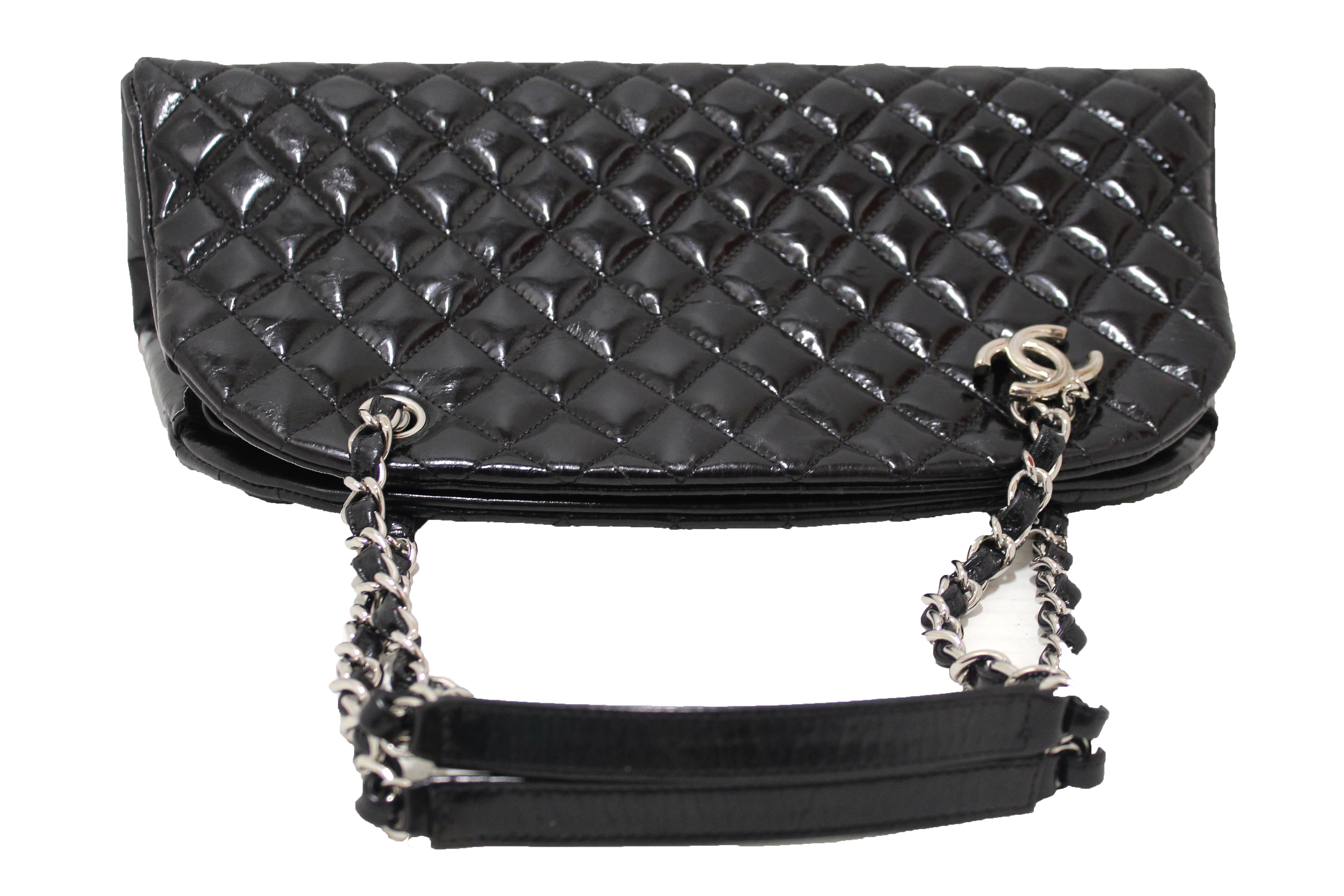 A BLACK PATENT LEATHER JUST MADEMOISELLE BAG WITH SILVER HARDWARE