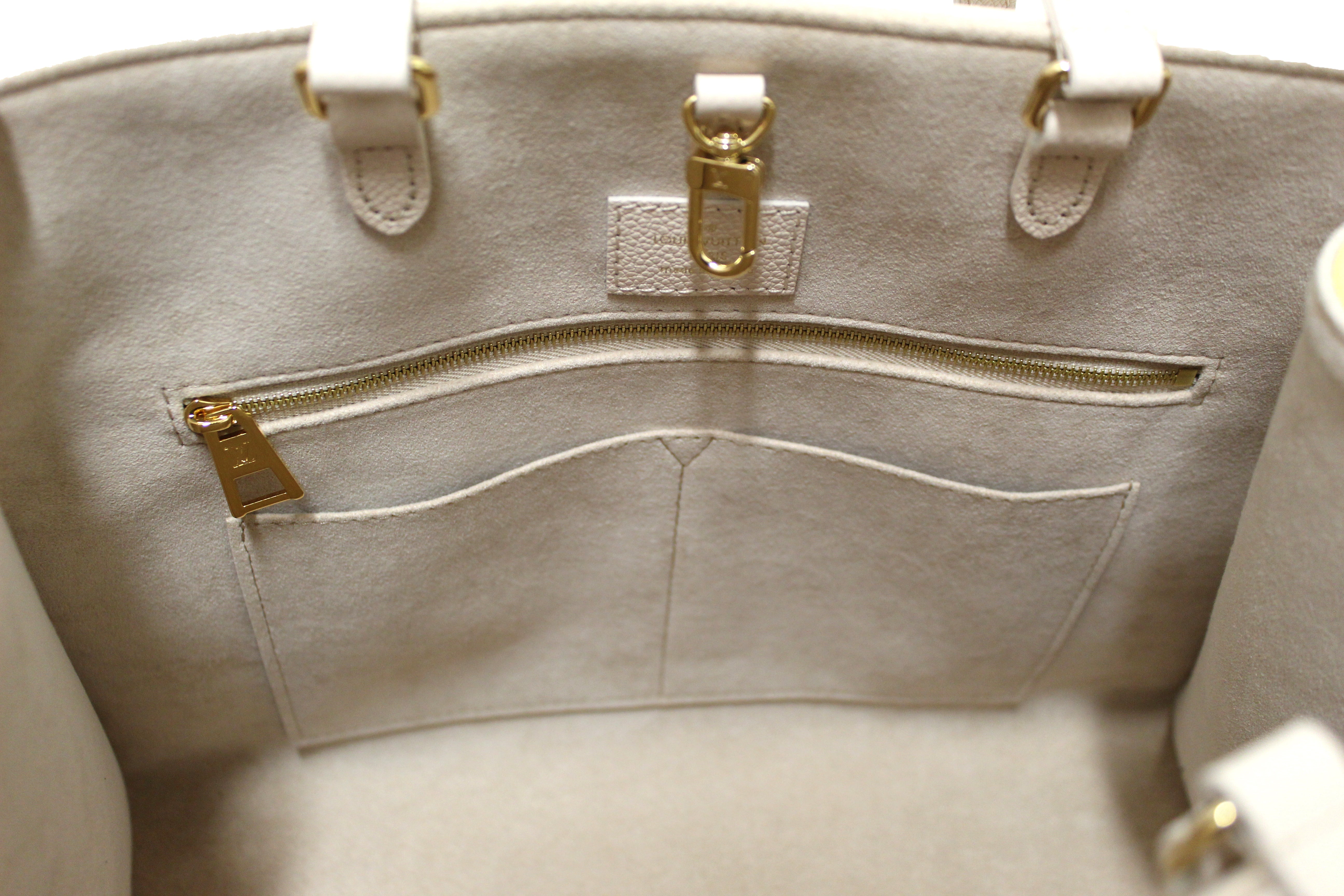 Authentic NEW Louis Vuitton Rose Beige Monogram Empreinte Cowhide Leather OnTheGo MM Bag